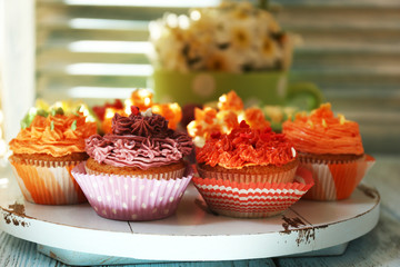 Tasty cupcakes on table, close up