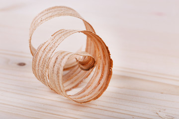 Wood shavings on wooden background