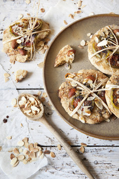 homemade rustic cookies with figs and almond slices on plate