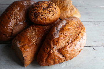 Fresh baked bread, on wooden background