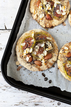 homemade rustic cookies with figs and almond slices on tray