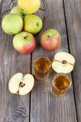 Naklejka na ściany i meble Still life with tasty apple cider in barrel and fresh apples