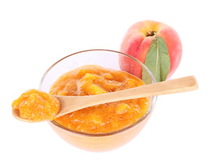 tasty peach jam with fresh peaches, isolated on white