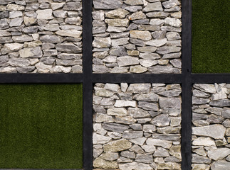 Artificial grass  and stone wall as background