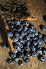 Tasty ripe blueberries, on wooden background