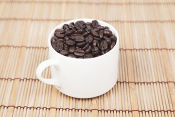 Glass of white coffee beans
