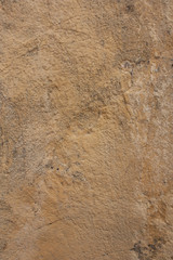 Rough rock background texture with orange and slight pink tints