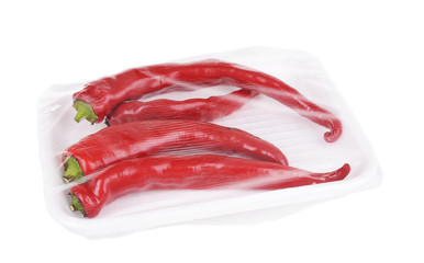 Pepper packed in food film isolated on white