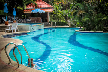 Activities on pool, boy swimming and playing in water. Koh Samui
