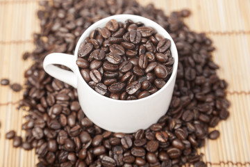 Coffee beans in coffee cup