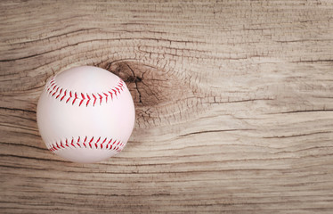 Baseball. Ball on wood background with copy space.