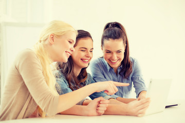 smiling students with tablet pc computer at school