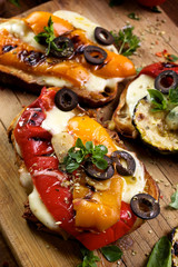 Bruschetta with grilled bell pepper, mozzarella cheese and herbs