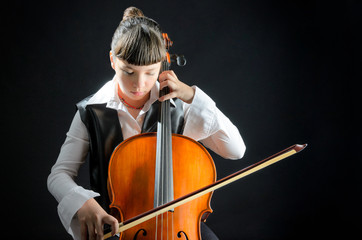Girl With Cello on Black Background © Marc Faur