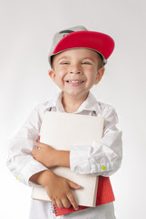 Young boy with books preparing to school