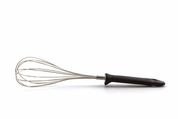 Metal whisk for whipping eggs on white background.