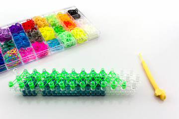 Close up Colorful of elastic rainbow loom bands in box.