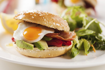 sandwich with avocado, egg, roasted peppers and bacon