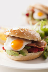 sandwich with avocado, egg, roasted peppers and bacon