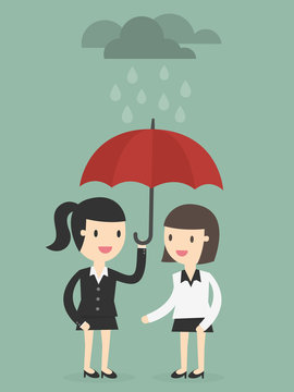business woman with umbrella protects another woman from rain