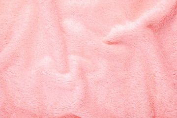 soft pink texture of bath towel folded as a background