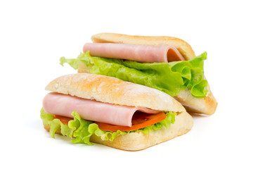 Two sandwiches with slice of ham