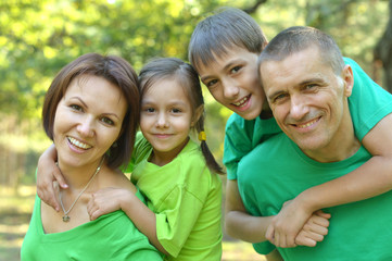 Fototapeta premium Cheerful family in green shirts