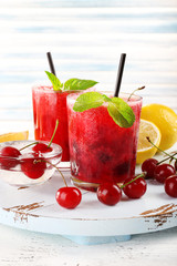 Fresh cold cherry cocktail with mint and lemon