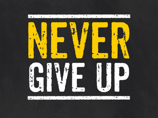 Blackboard with the text Never give up