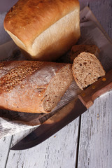 Fresh baked bread, on wooden background