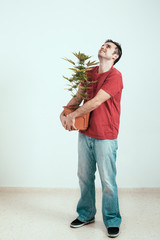 Happy man with Cannabis plant
