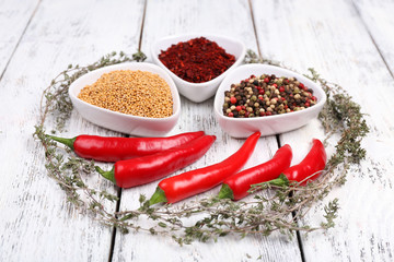 Spices in glass round bowls with herbs and chilly pepper