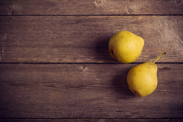 pears fruits on old wooden table background