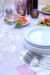 Buffet table with dishware waiting for guests