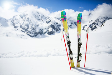 Skiing , mountains and ski equipments on ski run