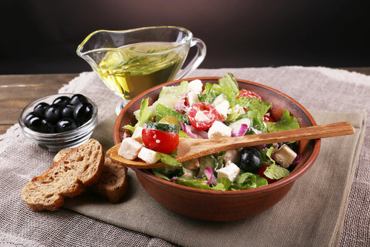 Bowl of Greek salad served with olive oil