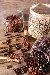 Glass jars and spoon with coffee beans
