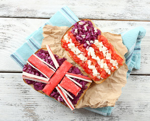 Sandwiches with  different flags on table close-up