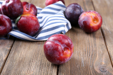 Sweet plums on wooden background