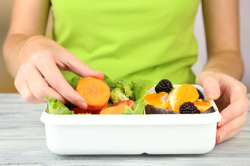 Woman making tasty vegetarian lunch, close up