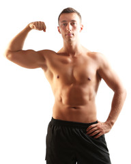 Fototapeta premium Handsome muscle young man isolated on white
