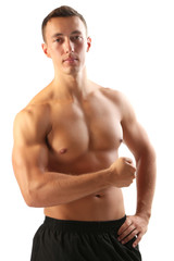 Fototapeta premium Handsome muscle young man isolated on white