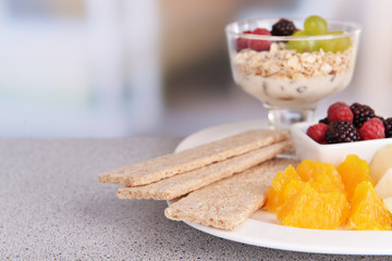 Slices of fruits with berries and muesli