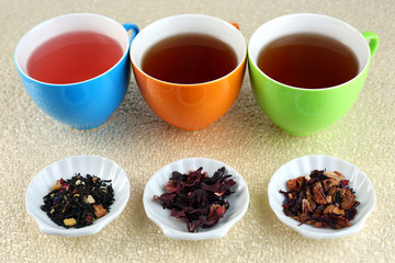 Assortment of tea on color background