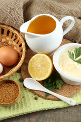Mayonnaise ingredients on wooden background