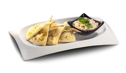 nachos, tortilla with yoghurt sauce decorated with basil and oli