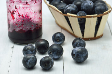 black plums in white background