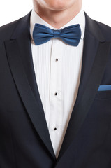 Closeup with suit, shirt and bow tie.