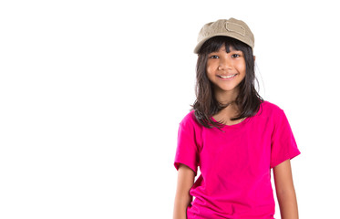 Fototapeta premium Young preteen Asian girl with a cap over white background
