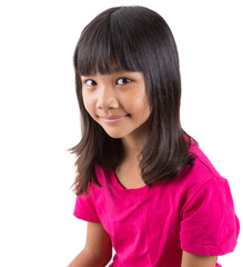 Young Asian preteen girl in pink t-shirt over white background